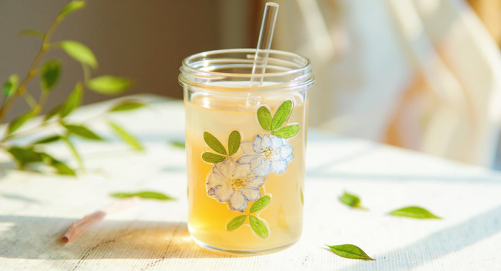 Handcrafted Preserved Flower Glass Cup 400ml with lid and straw on marble