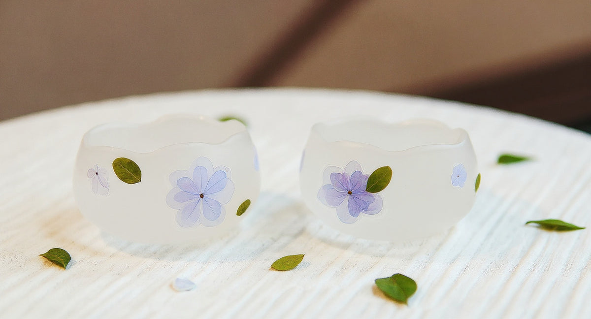 Handmade Floating Flower Teacup Set with frosted glass and real blue hydrangea on linen tray.