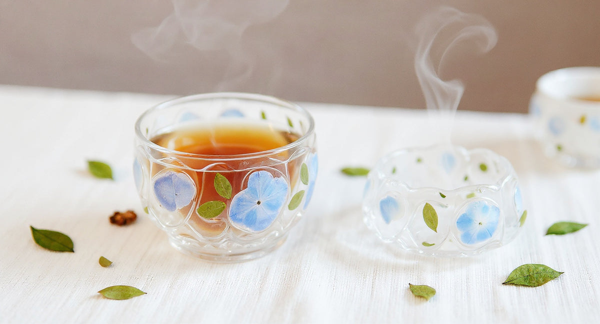 Pampasroom handmade glass tea cup set with preserved peacock hydrangea and scattered petals