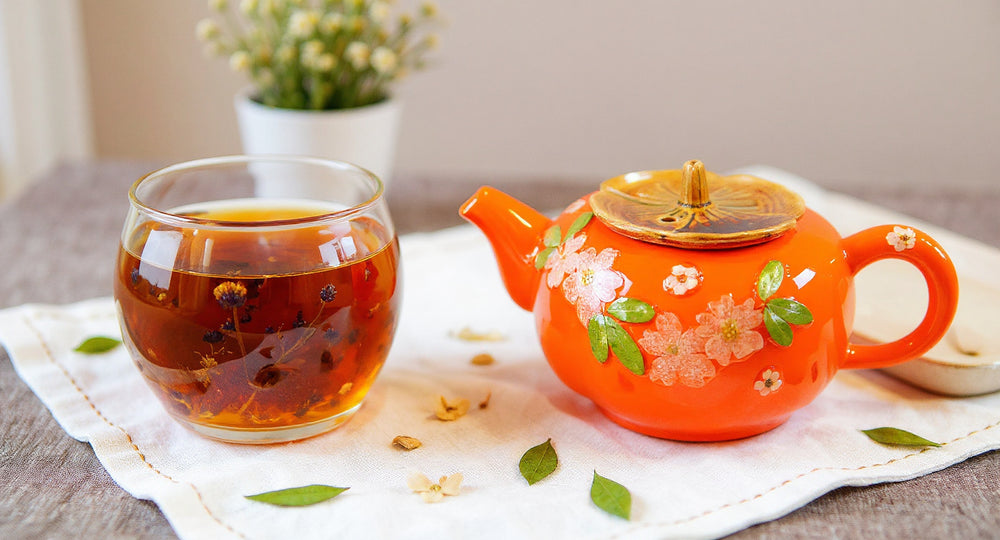 Pampasroom handmade teapot and cups with real pressed flowers on rustic linen