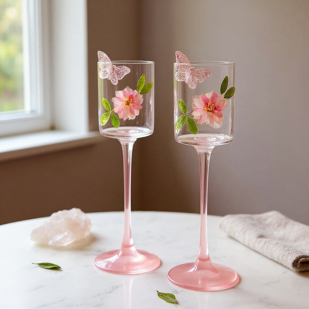 Elegant champagne flute with real dried flowers on marble surface