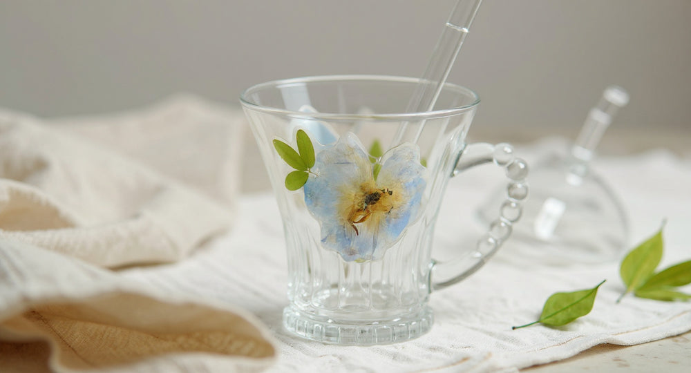 Handmade Real Flower Glass Cup 400ml Beaded Handle Preserved Floral Luxury Gift on linen with dried petals.