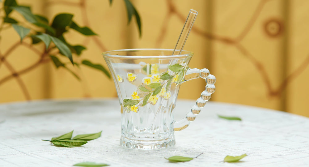 Handmade Glass Cup Real Pressed Flowers Beaded Handle Mug with lid and straw on oak table