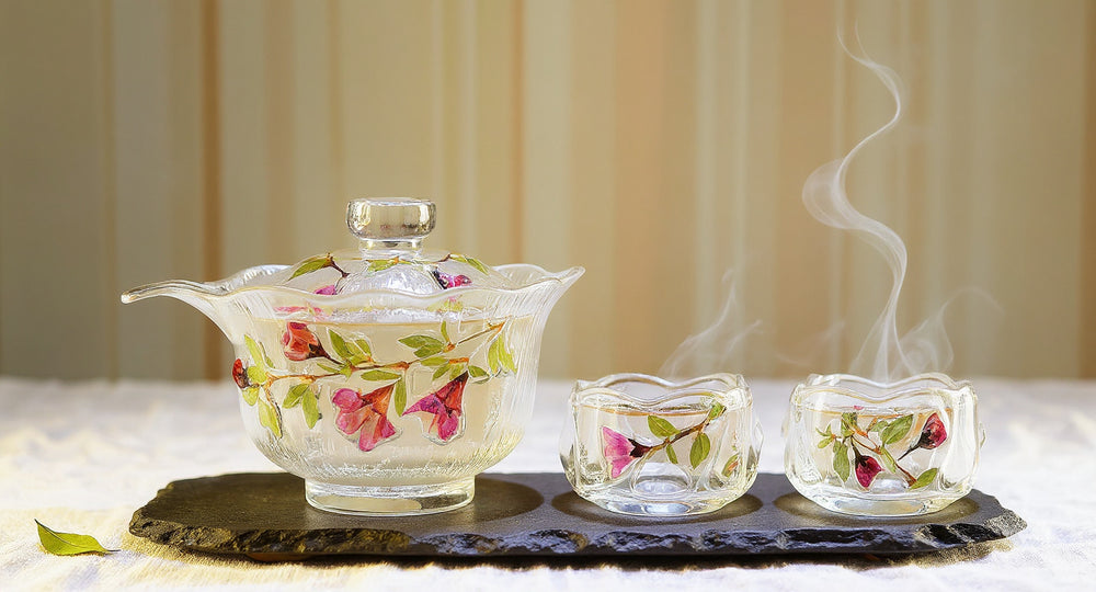 Handmade Rose Petal Glass Tea Set with lotus gaiwan, pitcher, and cups on wooden tray.