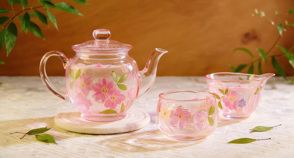 Handmade Sakura Glass Tea Set with real cherry blossom petals on wood board