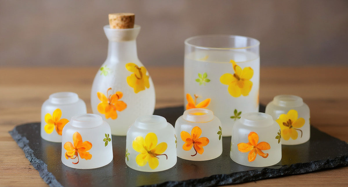 Handmade Pressed Flower Sake Set with glass carafe, four cups, and serving cup