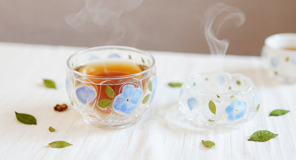 Pampasroom handmade glass tea cup set with preserved peacock hydrangea and scattered petals