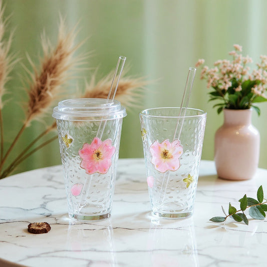 Real pressed flower glass cup with three-dimensional botanical relief on marble surface, where to buy authentic handcrafted cup with matching saucer, lid, and straw.
