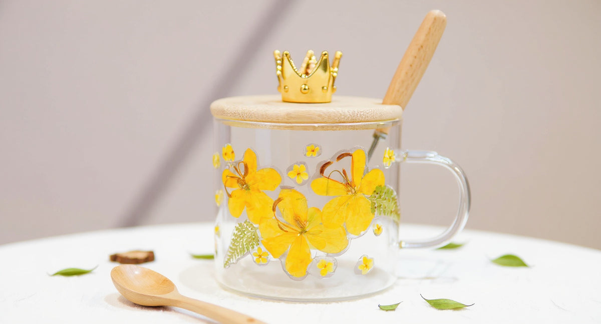 Handcrafted Glass Mug Real Pressed Flowers with bamboo lid and wooden spoon on rustic tray