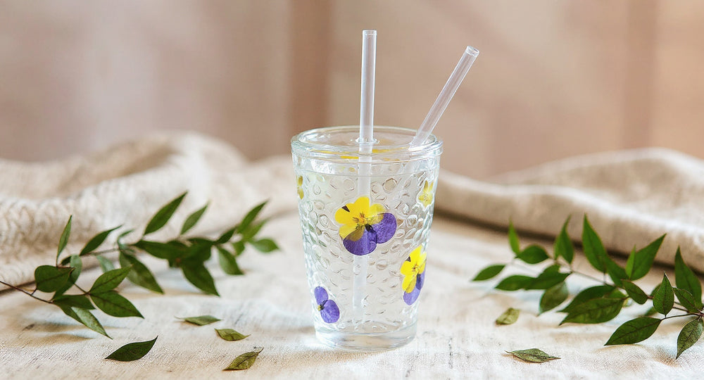 Handmade Pressed Flower Glass Cup Set with real preserved botanicals on cream linen.